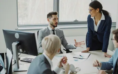Business professionals collaborating in a modern office meeting