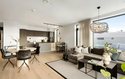 A living room filled with furniture and a large window