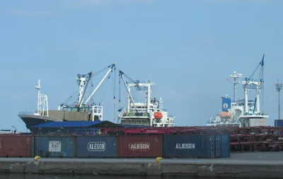 Cargo ships and shipping containers at a port
